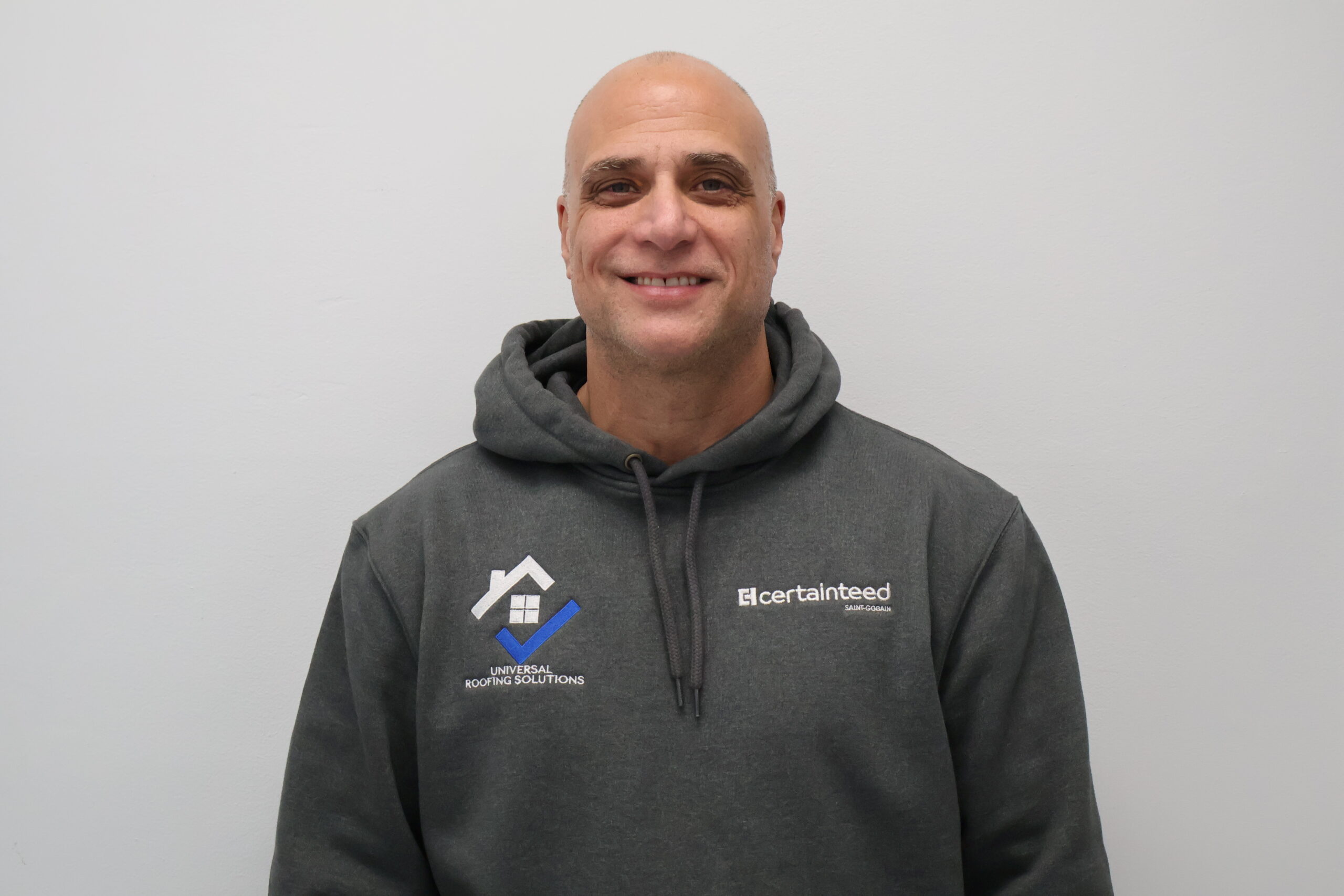 Technician performing roof repair on a residential property in Totowa, NJ​