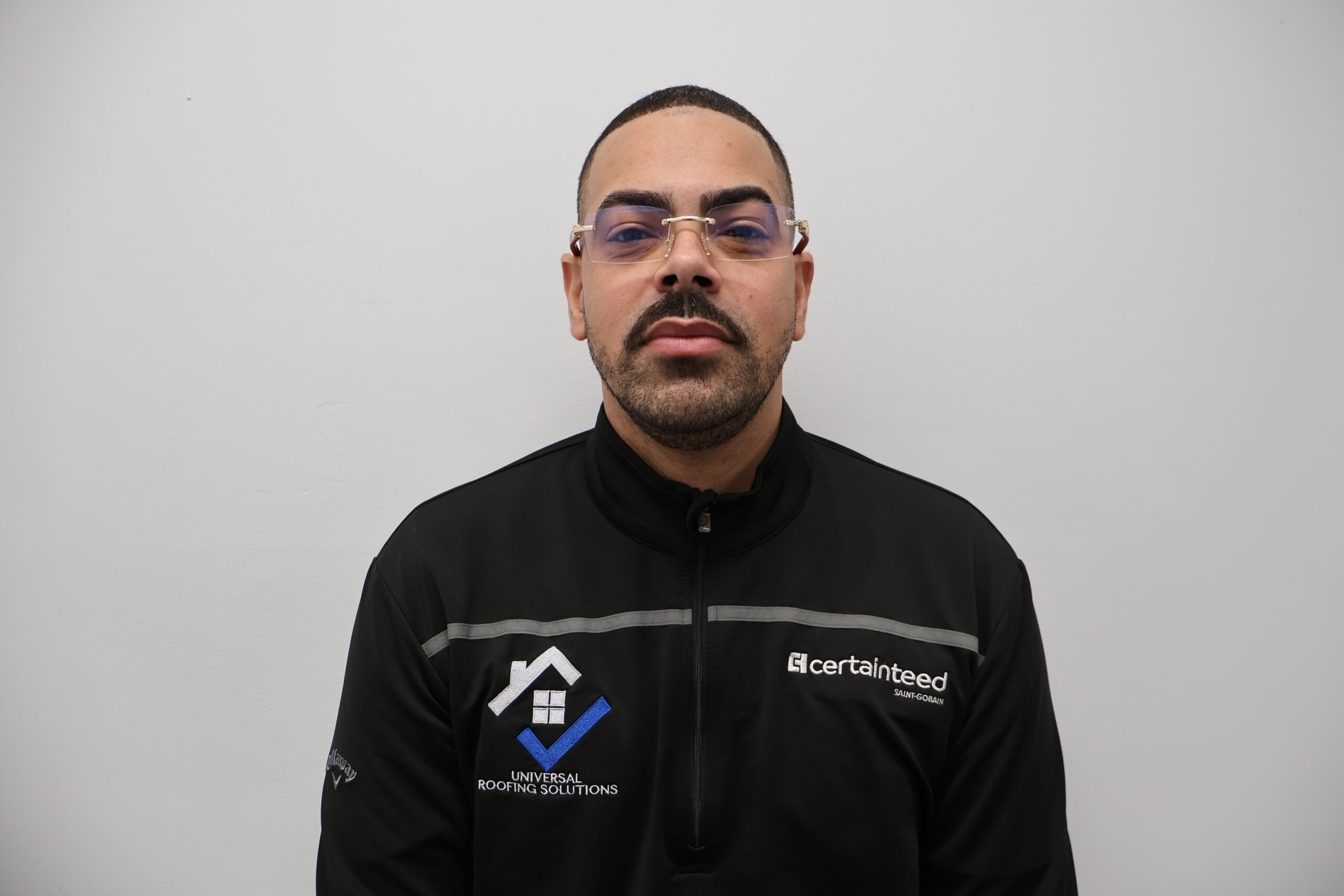 Technician performing roof repair on a residential property in Totowa, NJ​